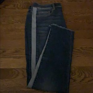 blue skinny jeans with light washed demon detail